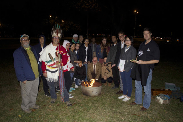 Friends, neighbors, community members, students around the ceremonial fire at our 7th annual Harvest           Celebration